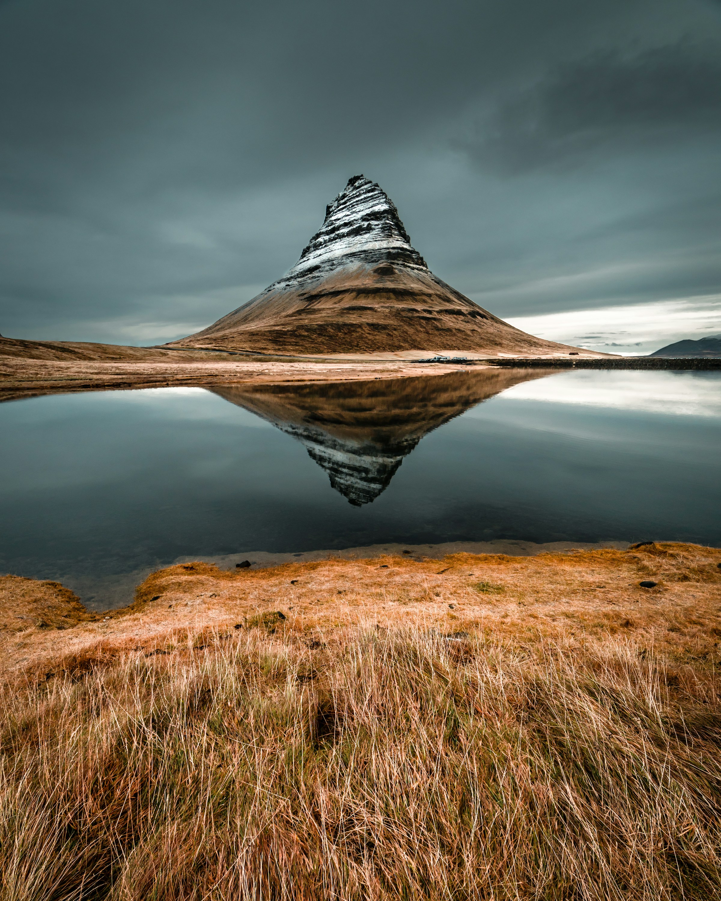 Kirkjufell reflected in still water
